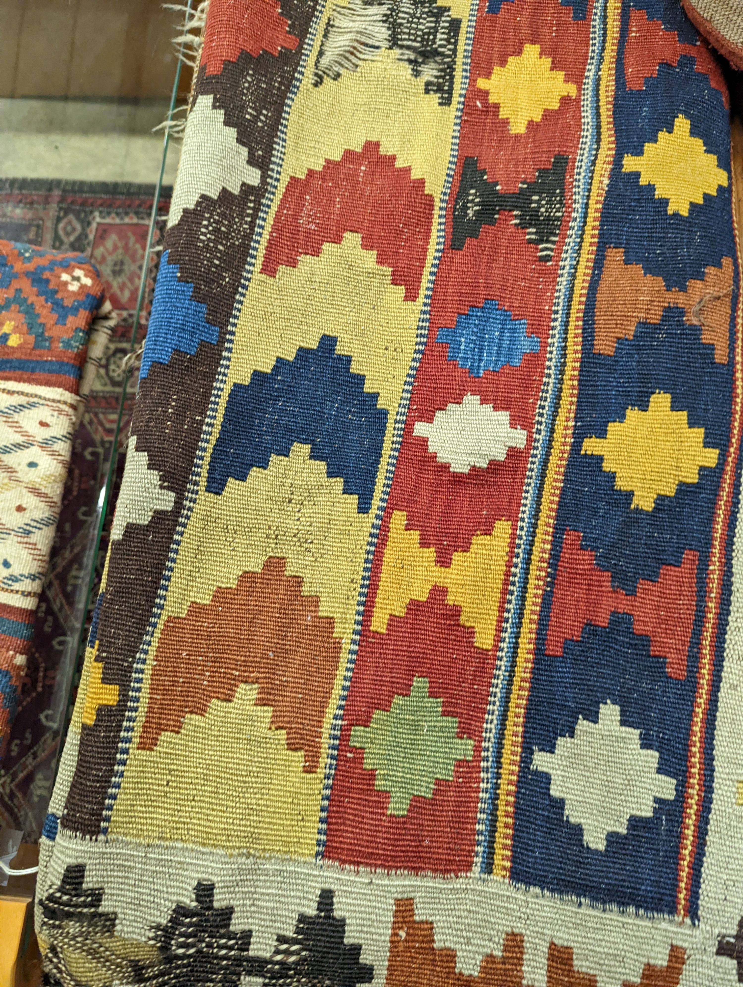 Two antique Kilim hall carpets, both with striped geometric decoration 270 x 128cm and 272 x 158cm both with some holes, 272 x 158cm